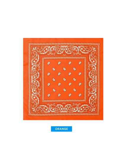 An orange bandana with a white paisley pattern and decorative border, shown flat against a white background with a blue label below reading ORANGE.